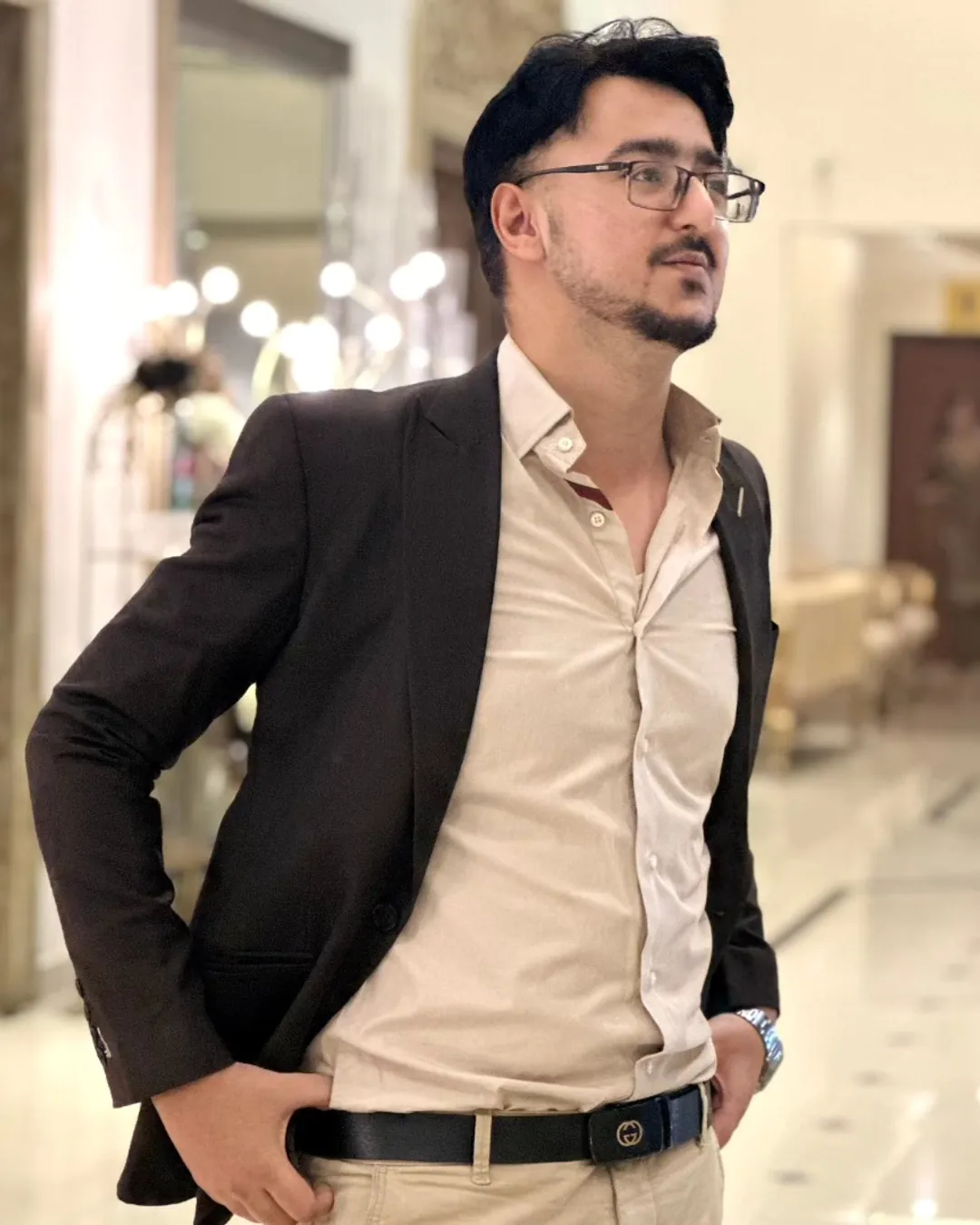 Ahmed Hussain, café consultant, in a blazer at a hotel lobby