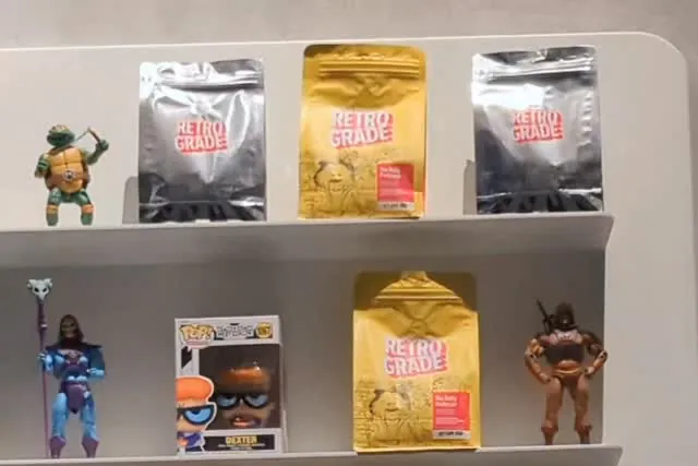 Freshly packed specialty coffee bags on a café retail shelf